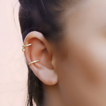 Gold conch and silver pave cartilage hoop earrings by AJJ, featuring small huggie and tragus hoops for cartilage and helix piercings.