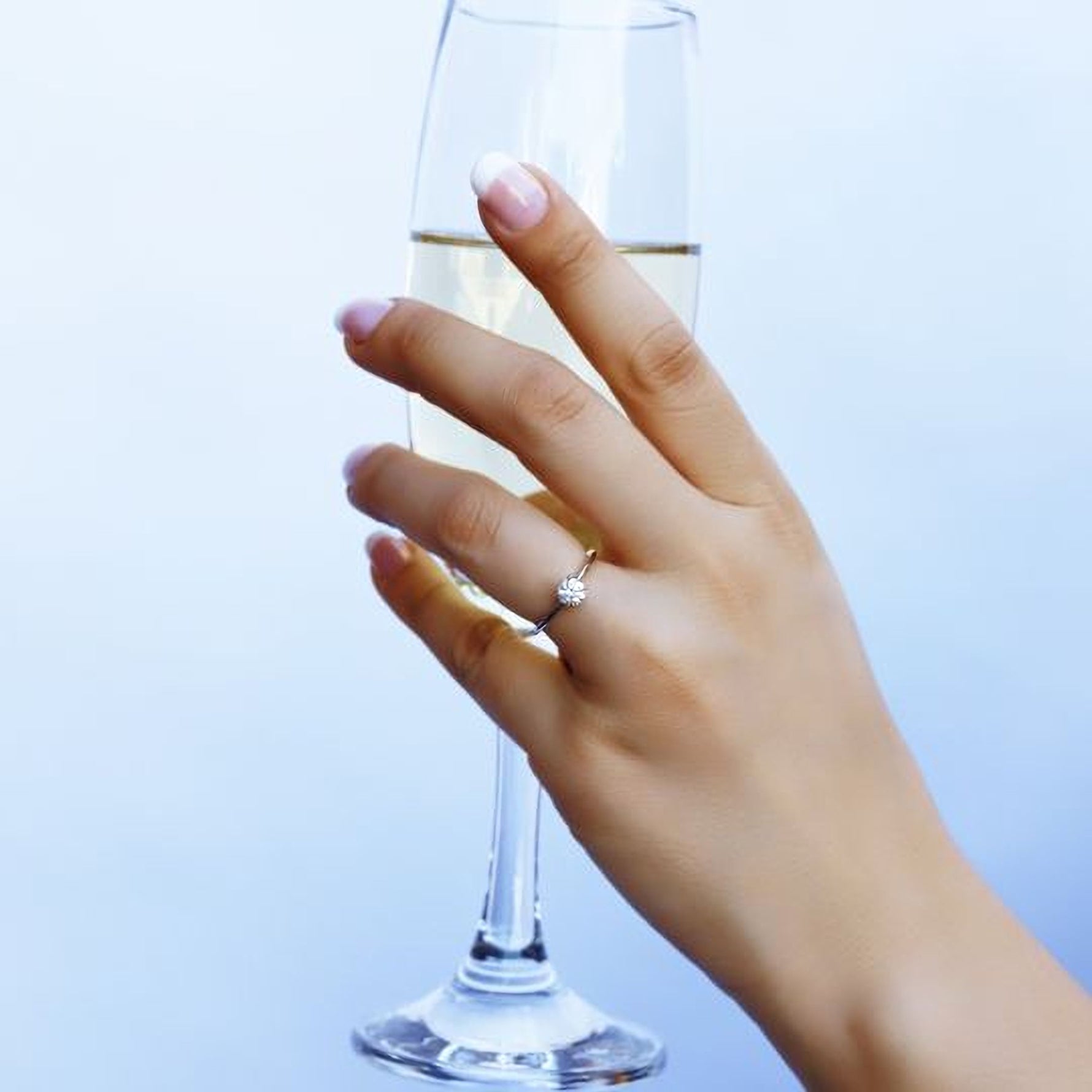 Sterling silver bridal engagement ring by AJJ, featuring a delicate design perfect for promise or wedding occasions.