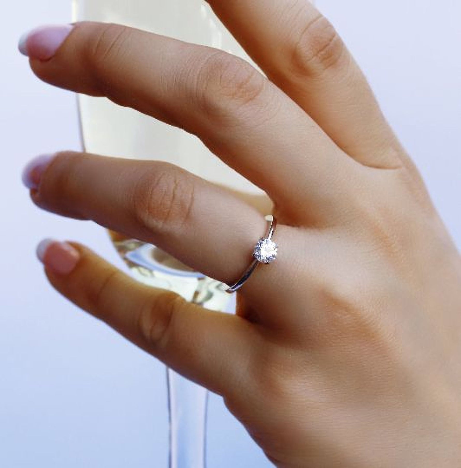 Sterling silver bridal engagement ring by AJJ, featuring a delicate design for women, available in US and UK sizes.