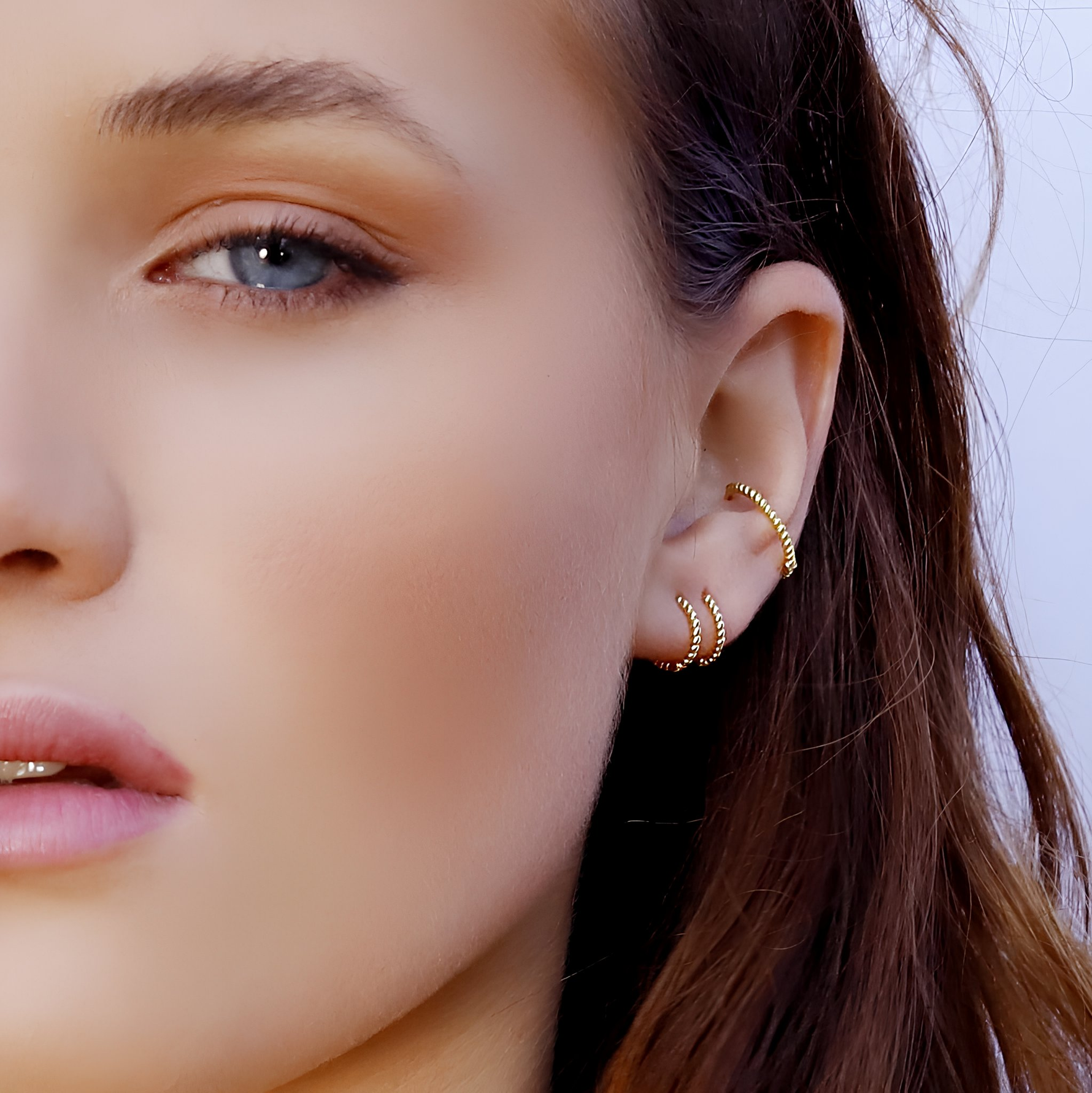 AJJ BELLA minimalist huggie hoops, small silver earrings with delicate conch design, perfect for subtle, stylish jewelry.