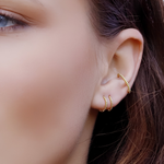 AJJ Bella minimalist silver huggie hoops, small delicate conch earrings, tiny hoop earrings with a sleek, simple design.