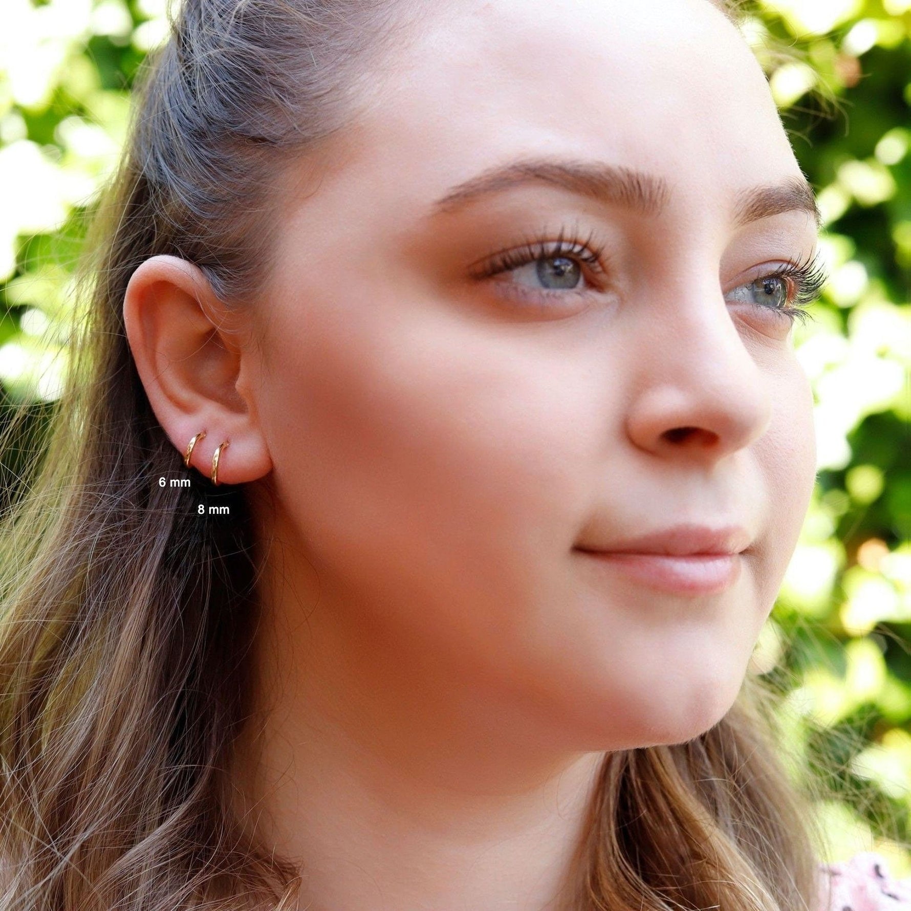 Sterling silver huggie hoop earrings by AJJ, delicate open geometric silver hoops with minimalist design, simple and stylish.