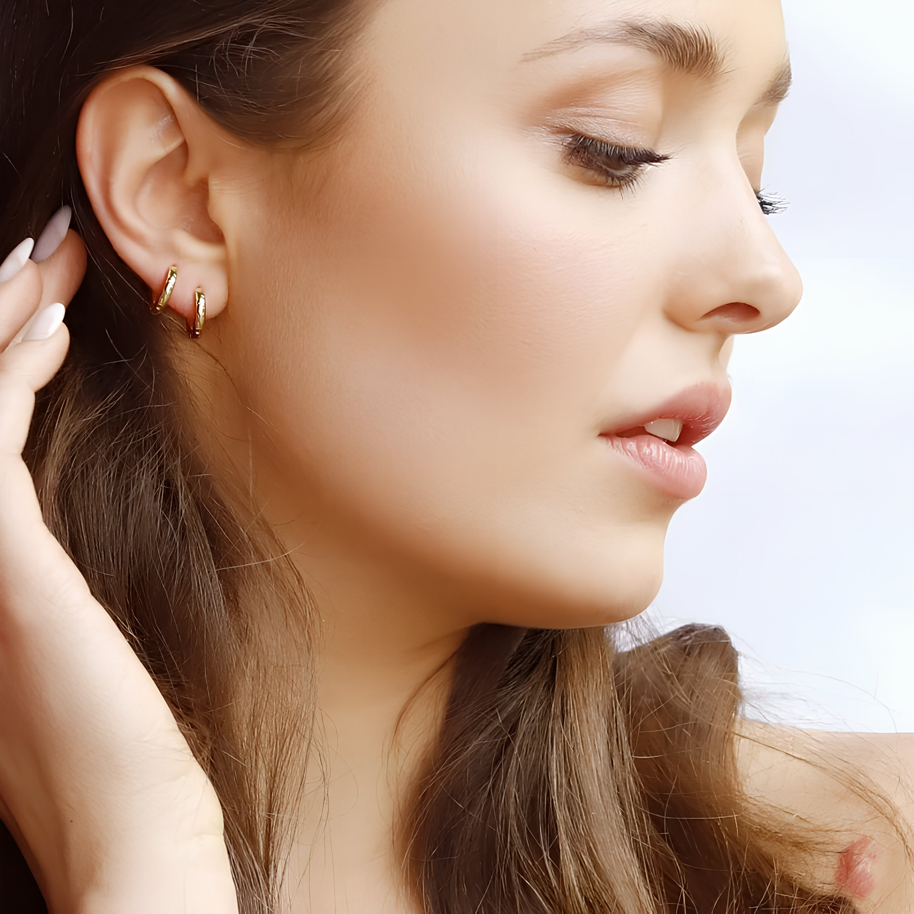 AJJ Benny-Huggie Hoop Earrings in gold with a minimalist hammered effect, small delicate sleeper hoop for subtle style