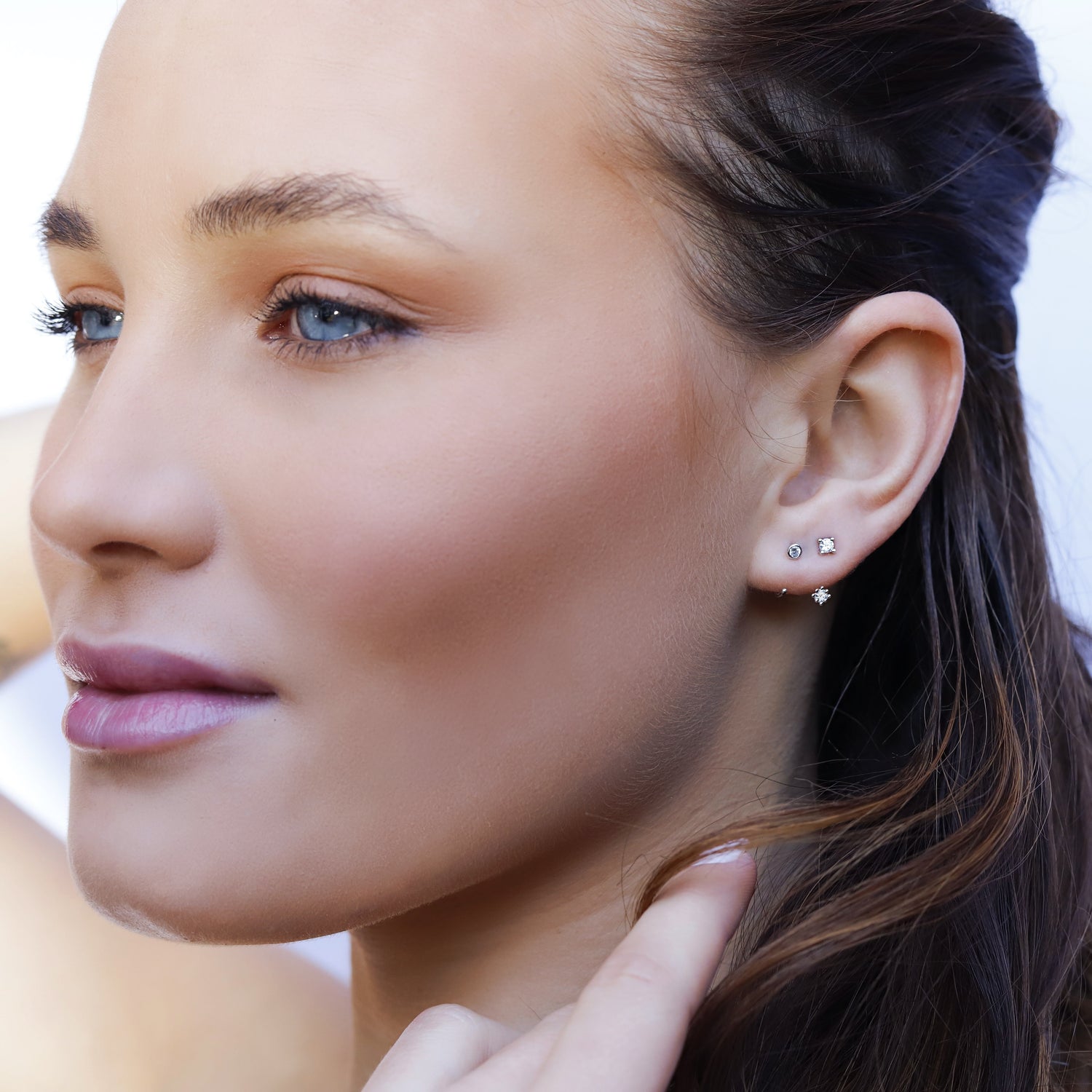 AJJ Scarlet minimalist silver bezel hoop earrings, small open dainty double hoop earrings on a clean background.