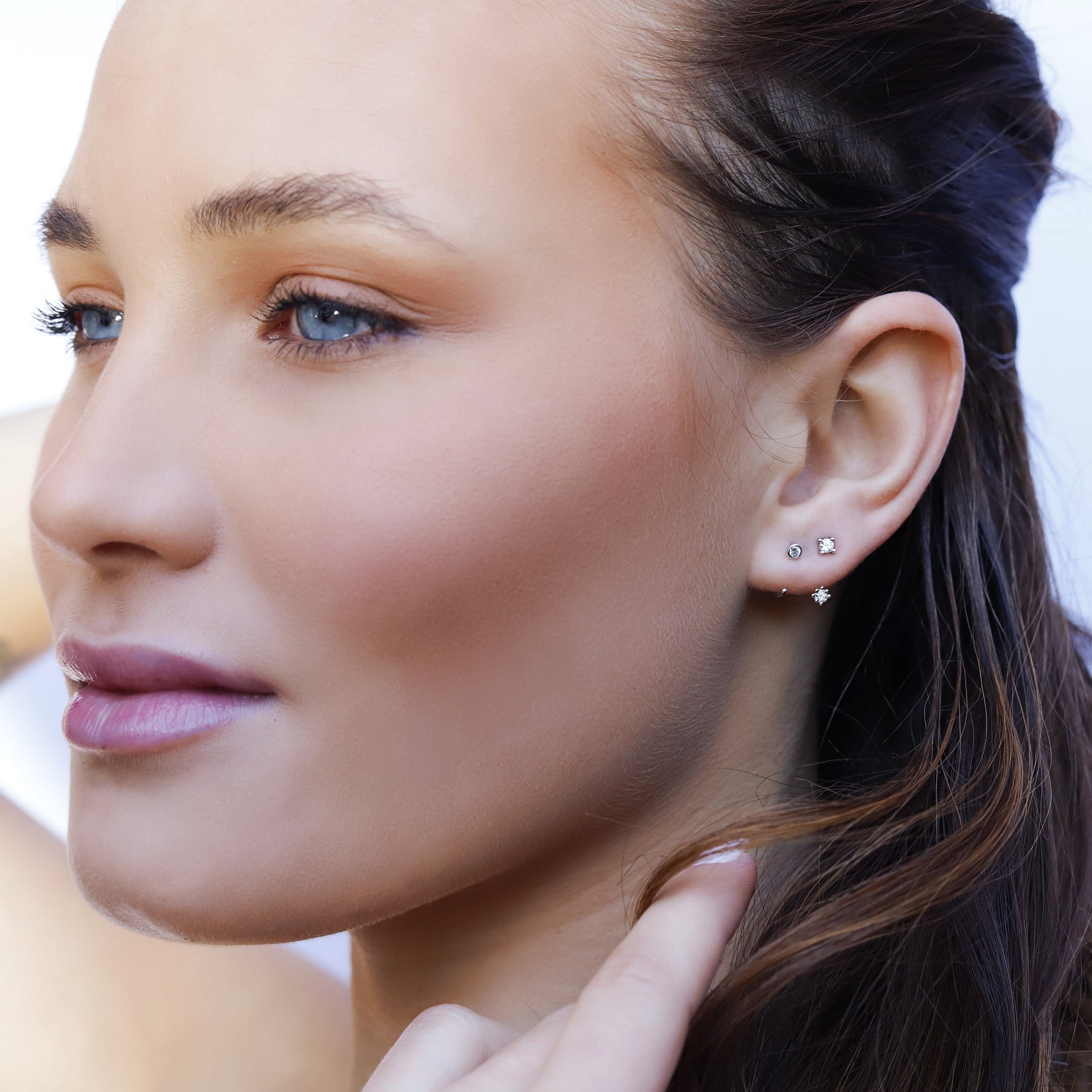 AJJ Scarlet minimalist silver bezel hoop earrings, small open dainty double hoop earrings on a clean background.