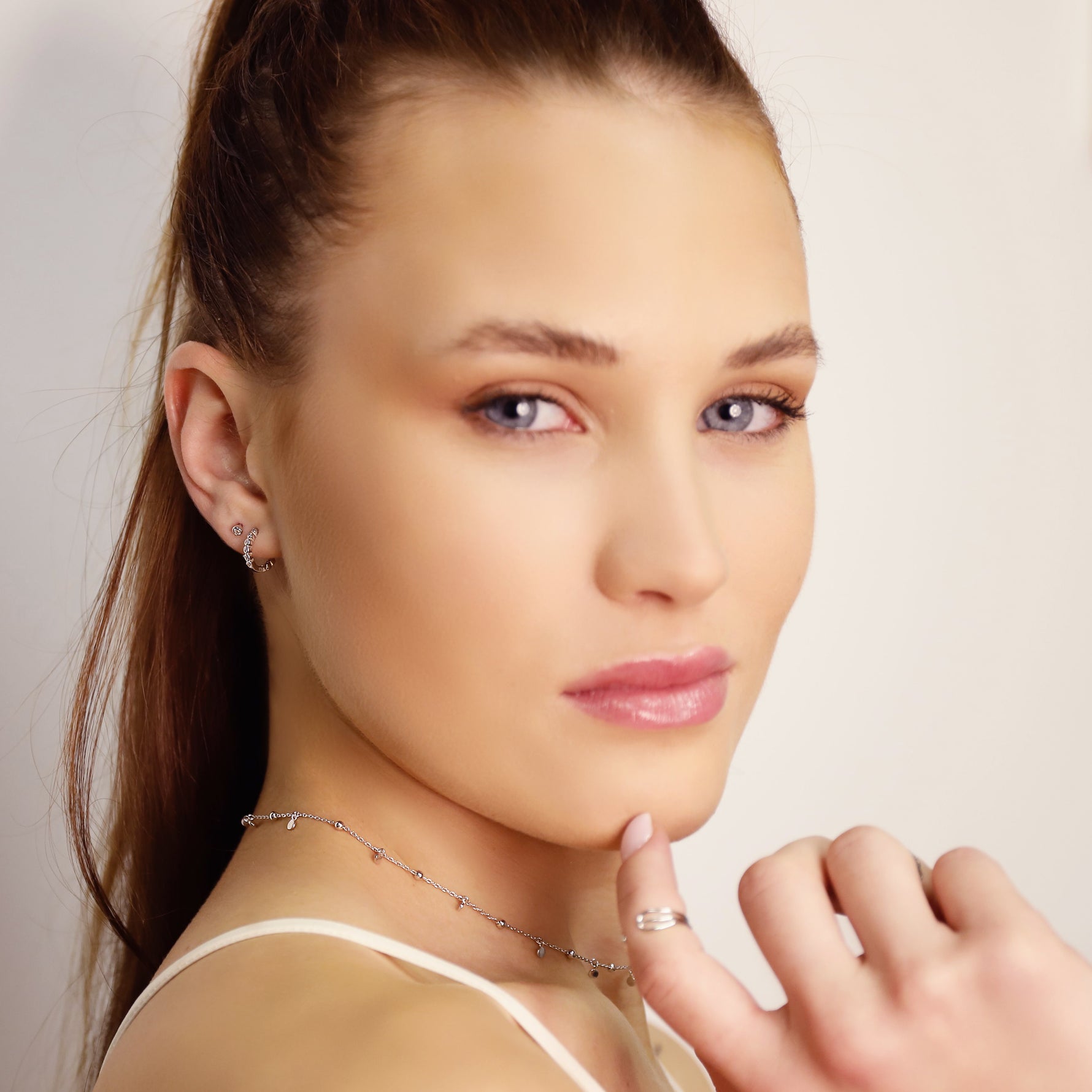 AJJ Shelly classic huggie hoops with 8mm CZ stones in yellow gold sterling silver 925, simple pave design for cartilage or earlobe.