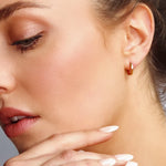 AJJ Pentagon Huggie Hoops featuring geometric dainty silver hoop earrings with a modern pentagon design.