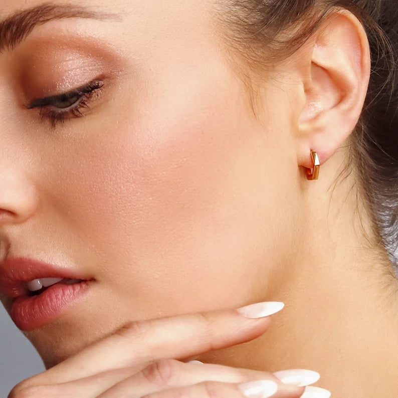 AJJ Pentagon Huggie Hoops featuring geometric dainty silver hoop earrings with a modern pentagon design.