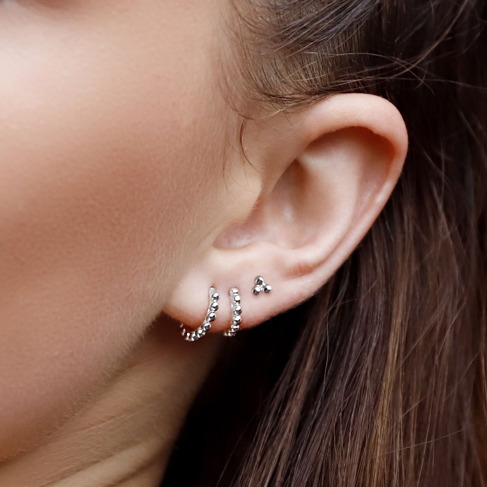 AJJ PIXIE sterling silver huggie hoop earrings with delicate bead design, minimalist silver hoops for everyday wear.