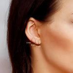 AJJ Tiny huggie hoop earrings, plain helix design, dainty gold hoop earrings suitable for everyday wear.
