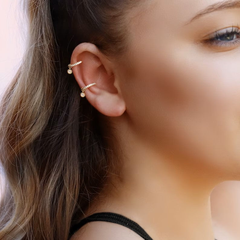 AJJ gold and silver conch and cartilage hoop earrings, small helix and tragus hoops, featuring pave ring detailing.