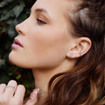 AJJ Bella minimalist silver huggie hoops, small delicate conch-style hoop earrings with a sleek, modern design