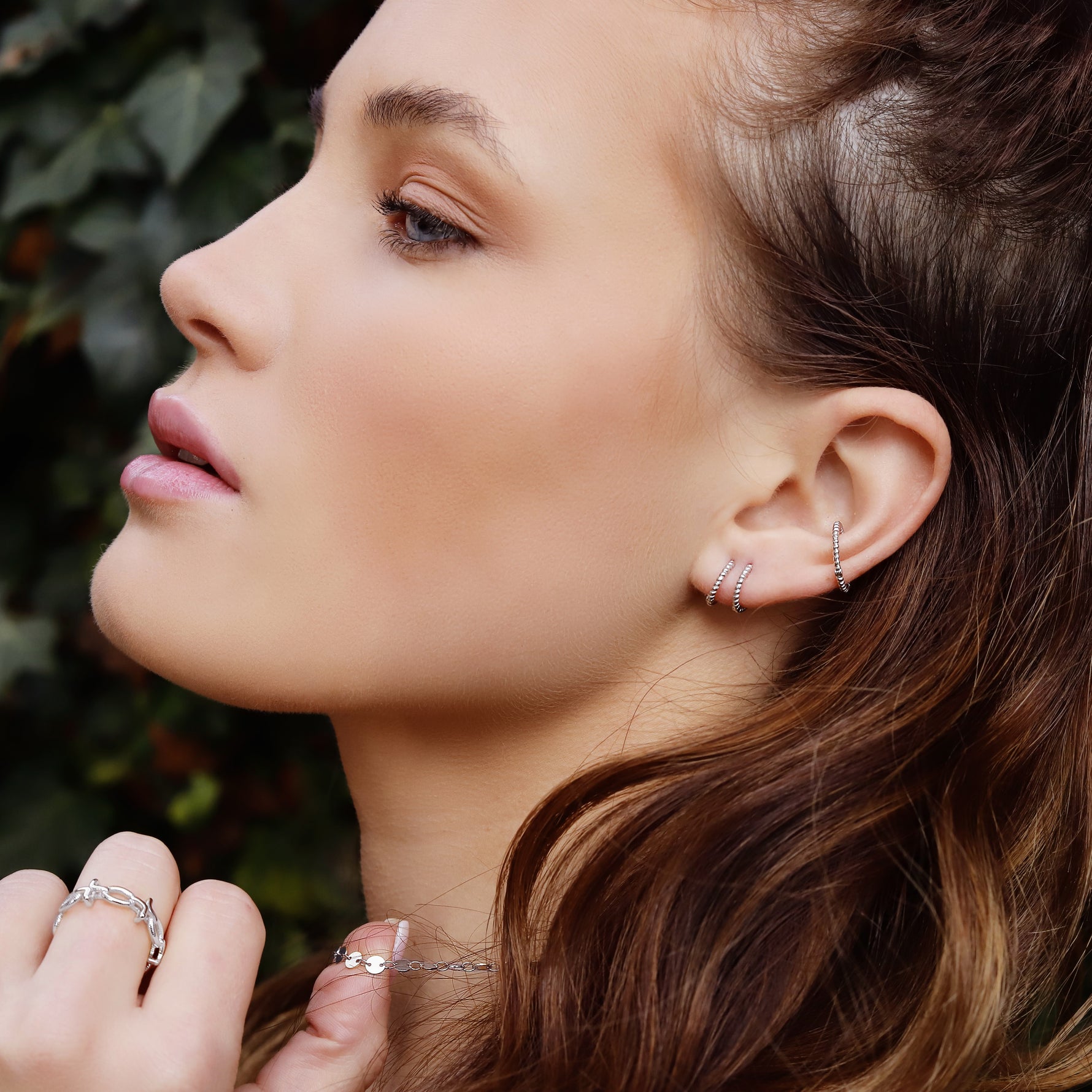 AJJ Bella minimalist silver huggie hoops, small delicate conch-style hoop earrings with a sleek, modern design