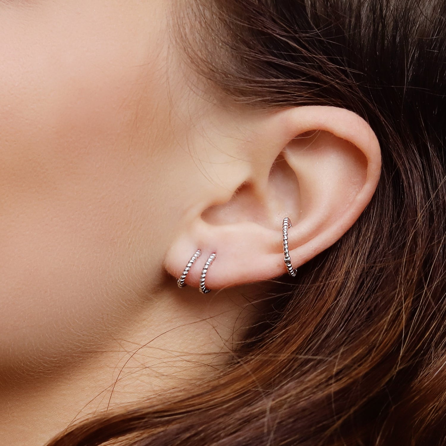 AJJ BELLA minimalist silver huggie hoops, small delicate conch earrings, tiny hoop earrings, stylish for everyday wear.