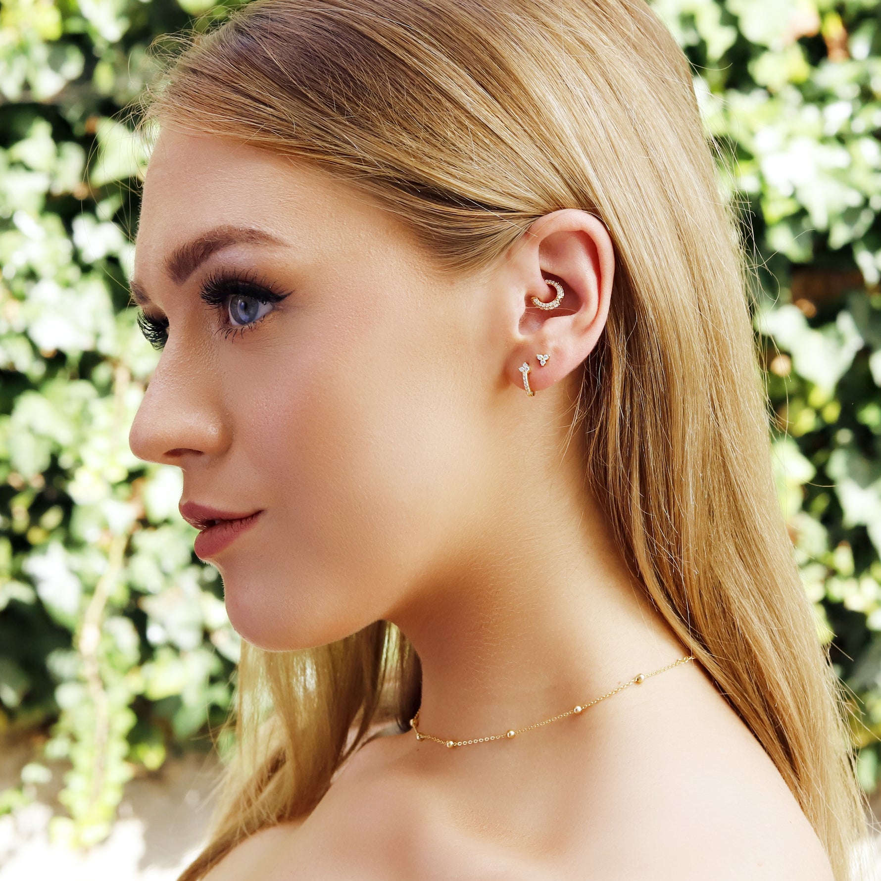 AJJ VIANNA silver minimalist huggie hoops, small open dainty hoop earrings, stylish silver huggie earrings on white background