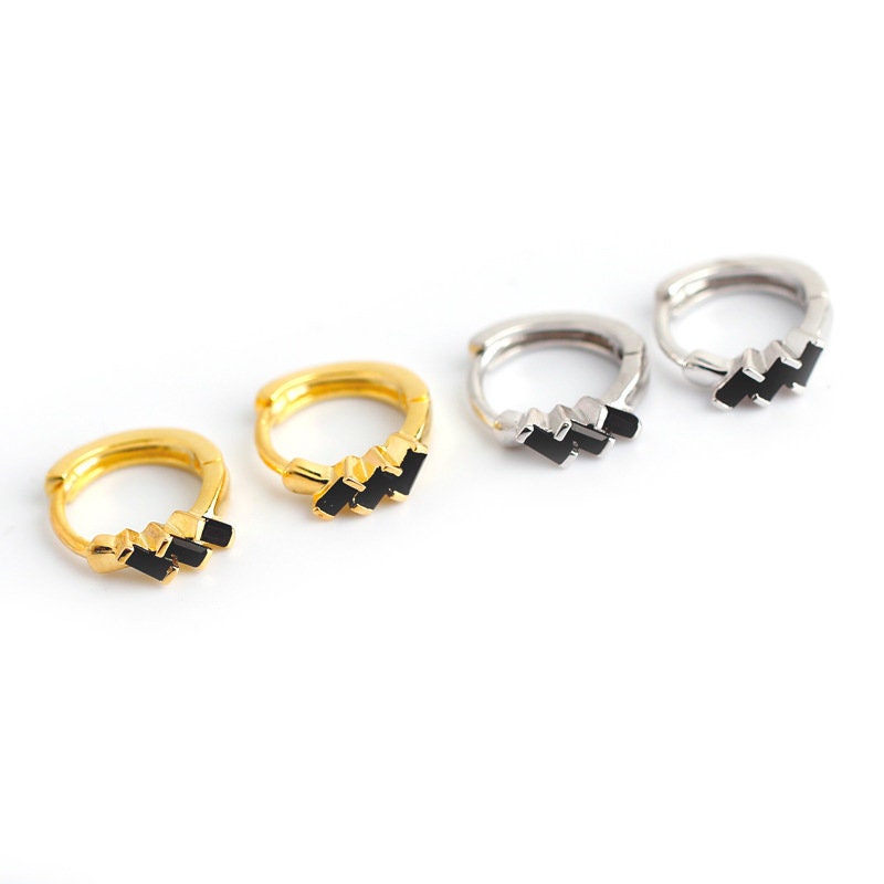 AJJ Poppy minimalist silver huggie hoops with small open dainty design, perfect for subtle, stylish earrings.