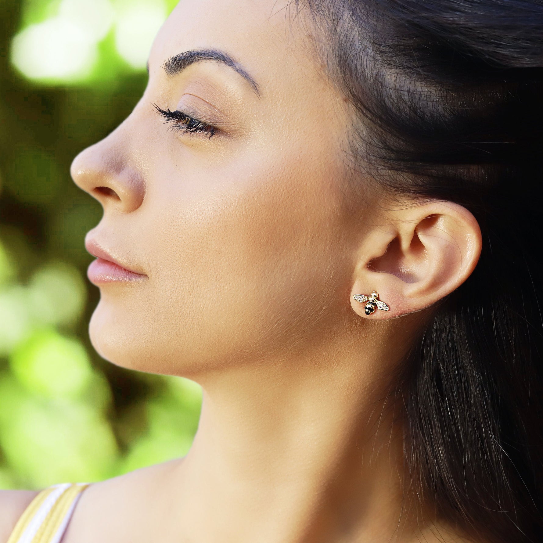 Silver stud earrings featuring a flying bee design, inspired by summer insects, by AJJ.
