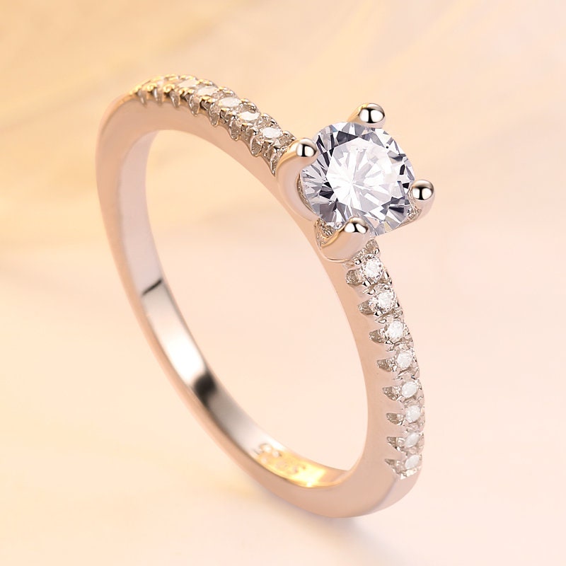 Sterling silver Sophia promise ring for women, featuring a sleek design, perfect for engagement or anniversary, in US sizes.