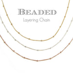 AJJ Niamh gold choker necklace featuring a delicate satellite chain design, close-up of the elegant satellite necklace on a model.