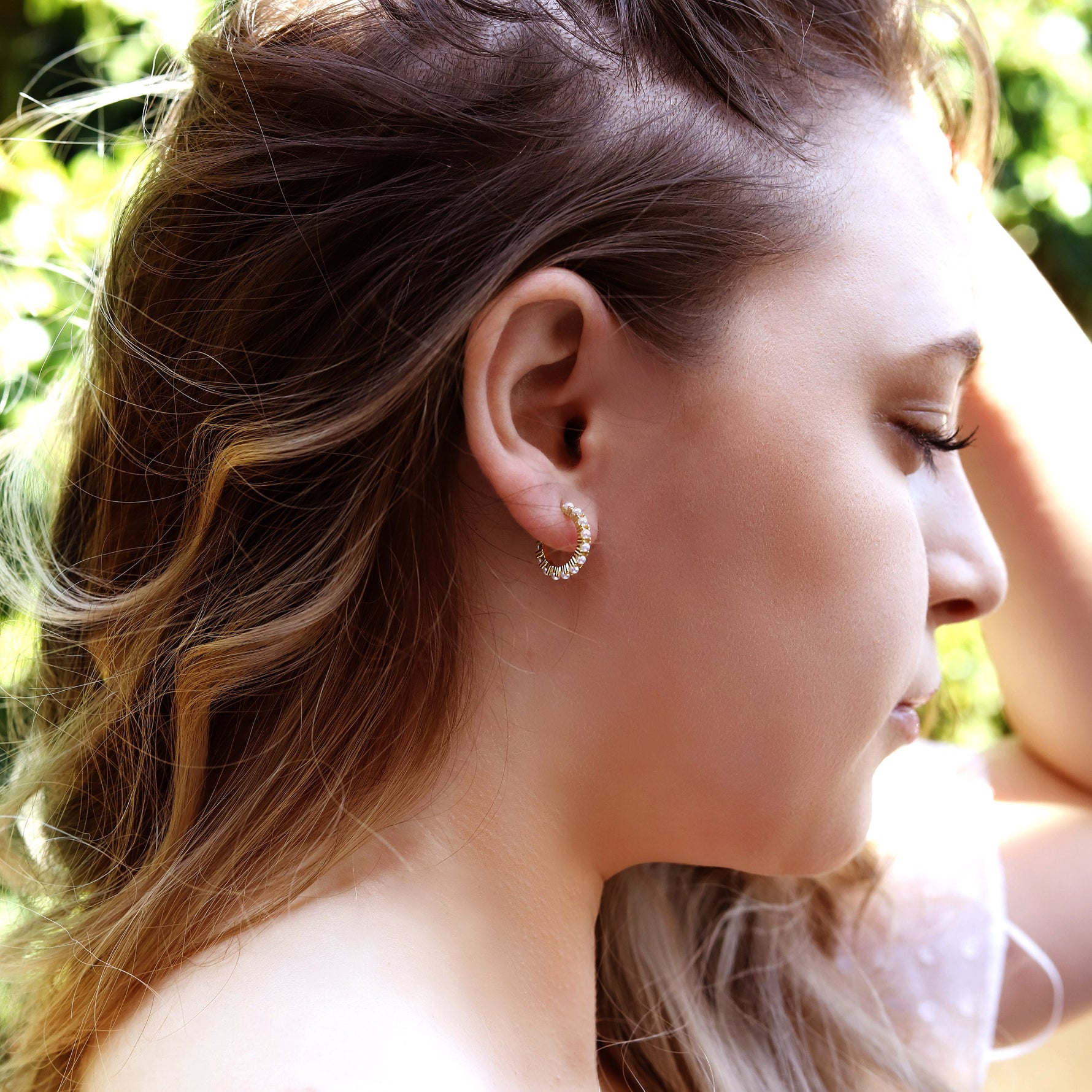 AJJ minimalist silver huggie hoop earrings with small pearl accents, dainty and stylish for everyday wear.