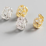 AJJ silver minimalist huggie hoops, small chunky and dainty hoop earrings, close-up view of stylish silver huggie earrings