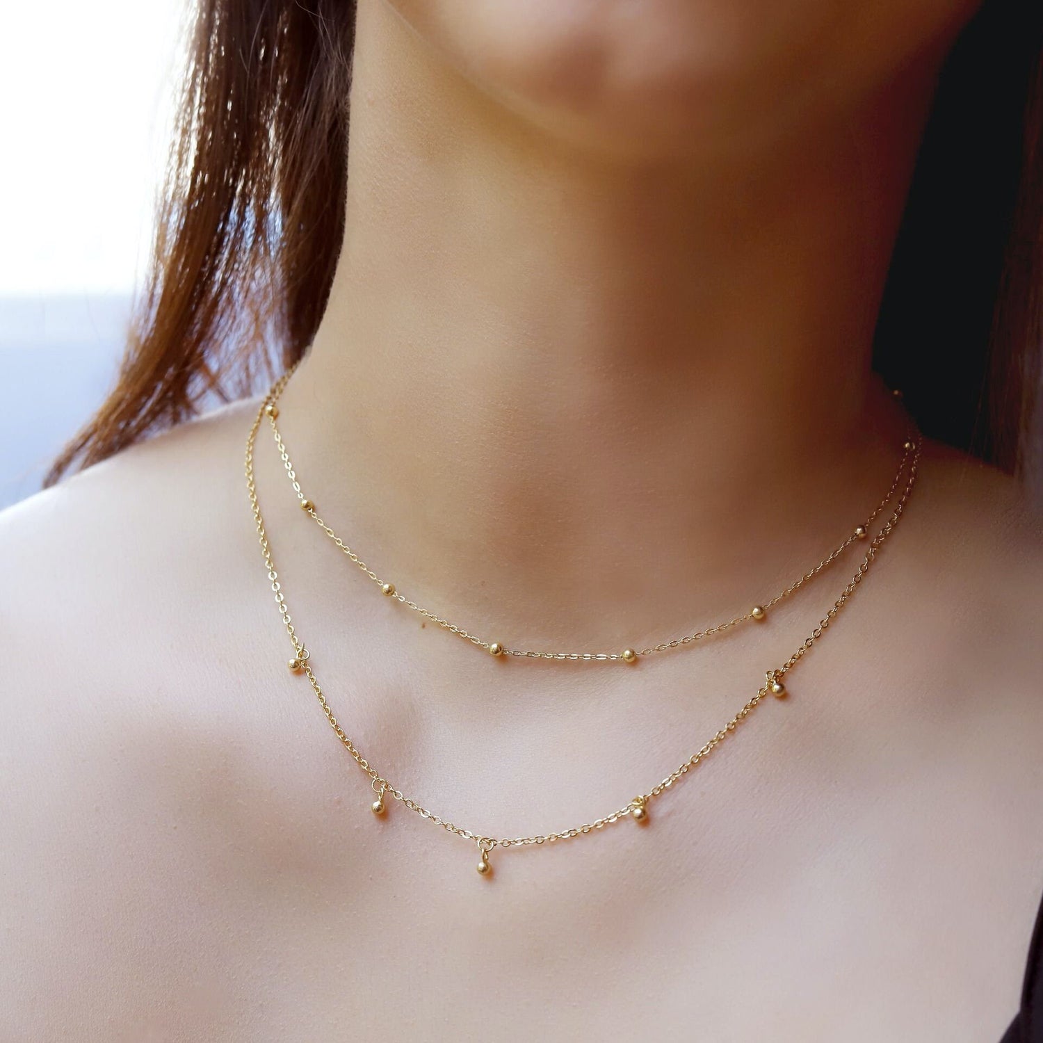 Beck dainty gold layering necklace by AJJ, 925 sterling silver with 18K gold plating, featuring small beaded design.