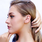 Sterling silver huggie hoop earrings by AJJ, featuring delicate open geometric hoops with a minimalist design.