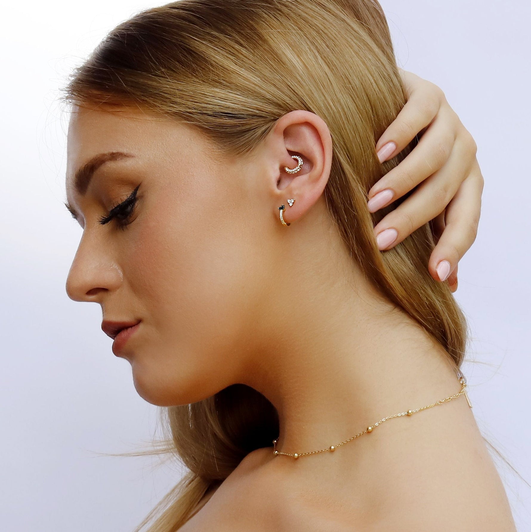 AJJ minimalist silver and gold huggie hoop earrings with dainty flower design, small club hoops for subtle, stylish wear