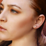 AJJ sterling silver huggie hoop earrings with a delicate open geometric design, minimalist silver earrings for everyday wear