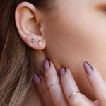 Sterling silver huggie hoop earrings by AJJ, delicate open geometric hoops, minimalist silver earrings with a sleek design.
