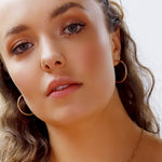 Pair of AJJ sterling silver 925 hoop sleeper earrings in various sizes, simple silver hoop earrings for everyday wear.