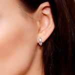 AJJ silver minimalist heart huggie hoops, small dainty silver hoop earrings with tiny heart details, perfect for everyday wear.