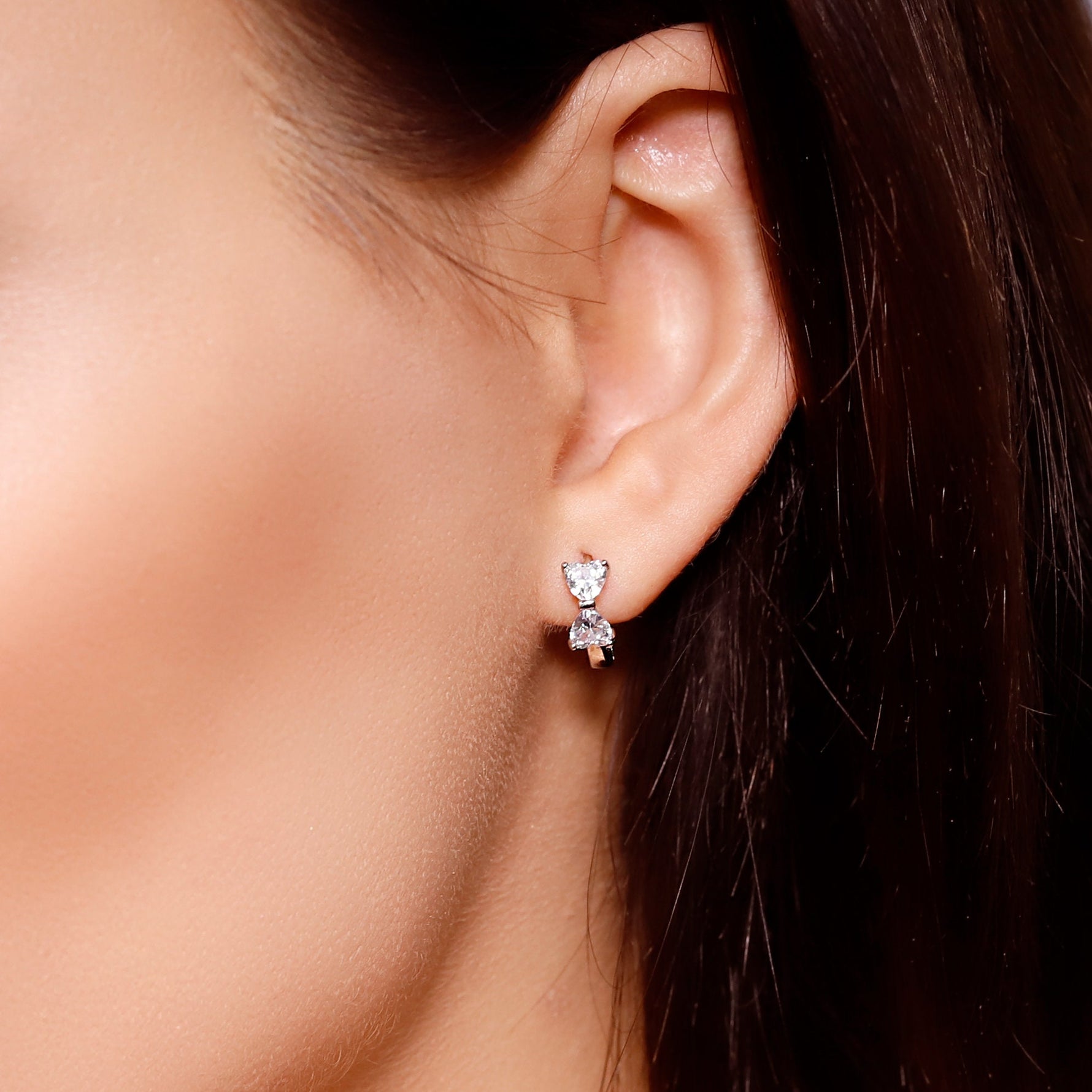 AJJ silver minimalist heart huggie hoops, small dainty silver hoop earrings with tiny heart details, perfect for everyday wear.