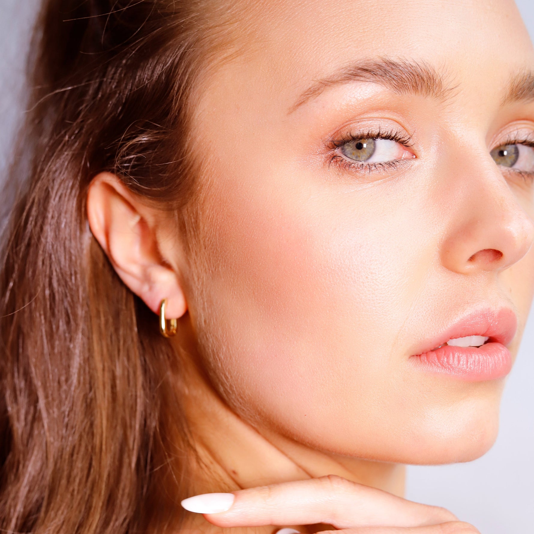 Small rectangular gold and silver huggie hoop earrings with geometric design, dainty and stylish for everyday wear.