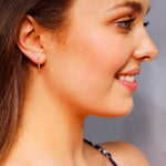 Small rectangular huggie hoop earrings by AJJ, silver and gold geometric dainty hoops with a modern rectangular design.