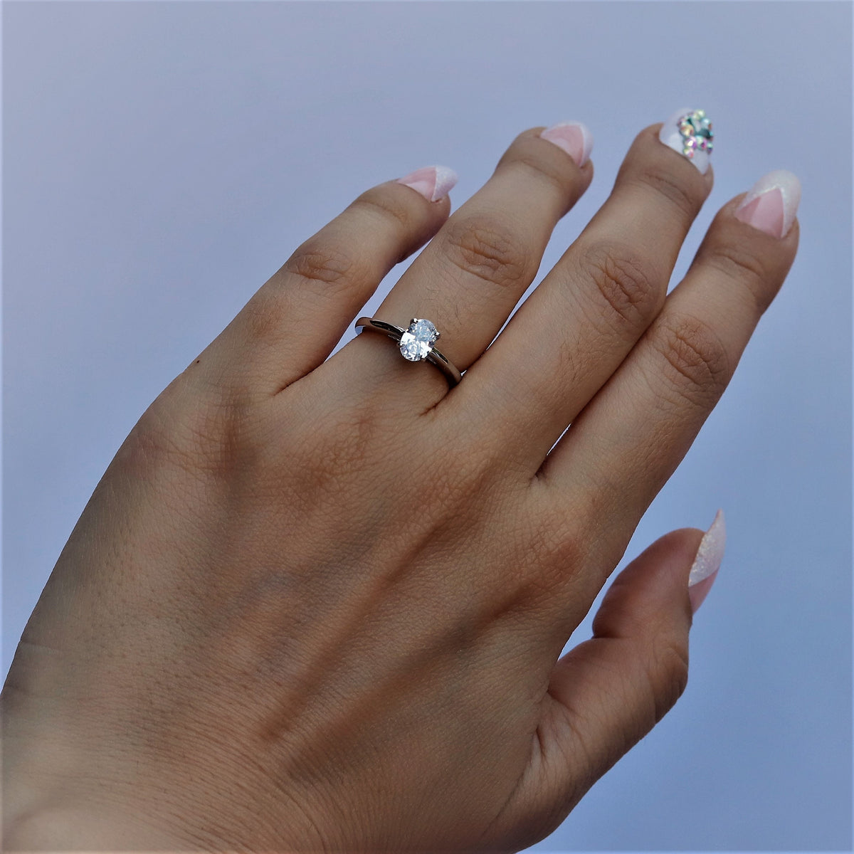 Sterling silver Isabella engagement and promise ring for women, featuring a elegant design, available in US and UK sizes.