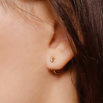Sterling silver huggie hoop earrings by AJJ, delicate open minimalist geometric silver hoops for a simple elegant look.