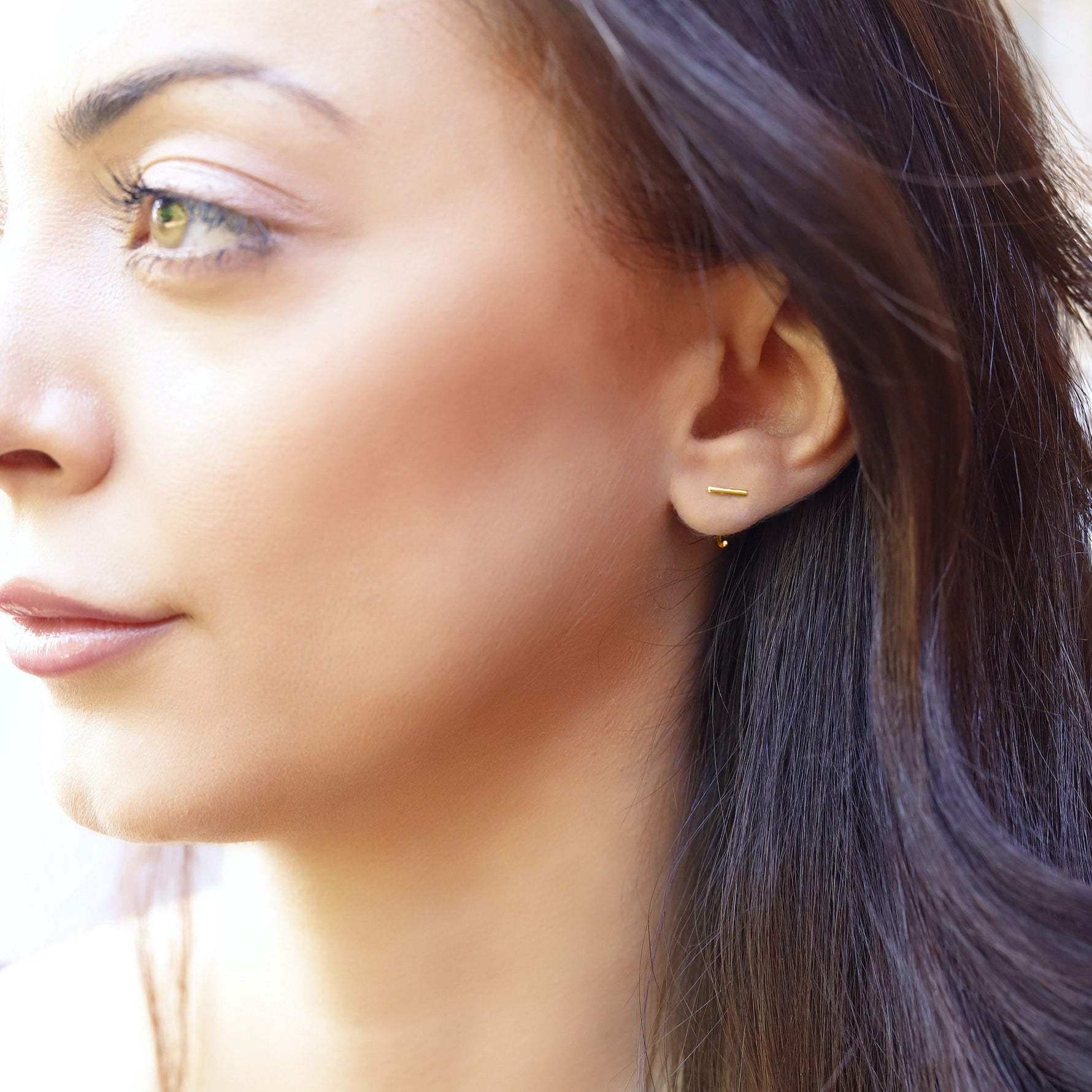 Small silver minimalist hoop earrings by AJJ, open dainty hoops with a simple, sleek design for everyday wear.