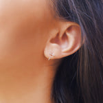 Small silver minimalist hoop earrings by AJJ, dainty open hoop jewelry with simple, sleek design for everyday wear.