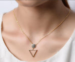 Gold circle crystal pendant necklace by AJJ featuring a delicate geometric design and elegant gold chain.