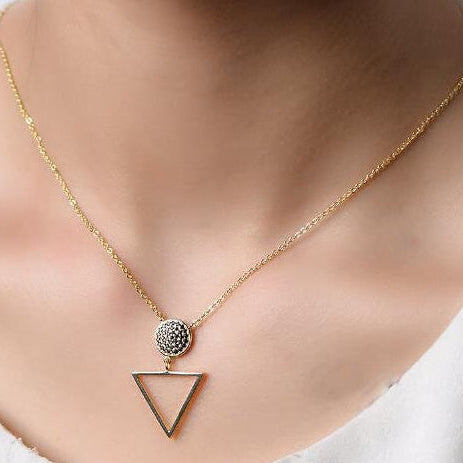 Gold circle crystal pendant necklace by AJJ featuring a delicate geometric design and elegant gold chain.