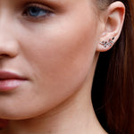 Sterling silver tiny leaves stud earrings by AJJ, featuring modern olive leaf design with sparkling accents.