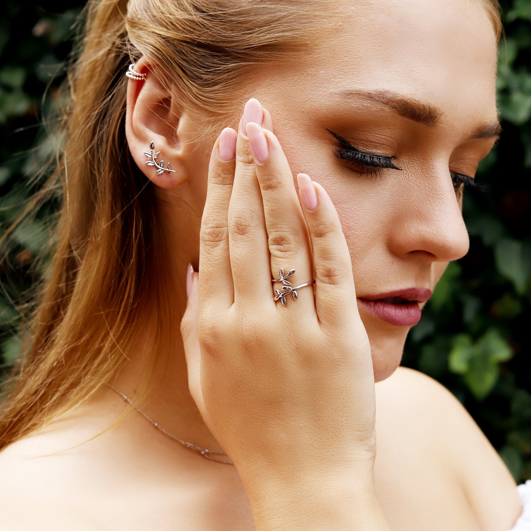 Sterling silver tiny leaves stud earrings by AJJ, featuring a modern design with delicate olive leaf details.