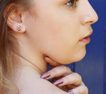 AJJ Tiny Knot Stud Earrings, minimalist jewelry for multiple piercings, small silver earrings with sleek knot design