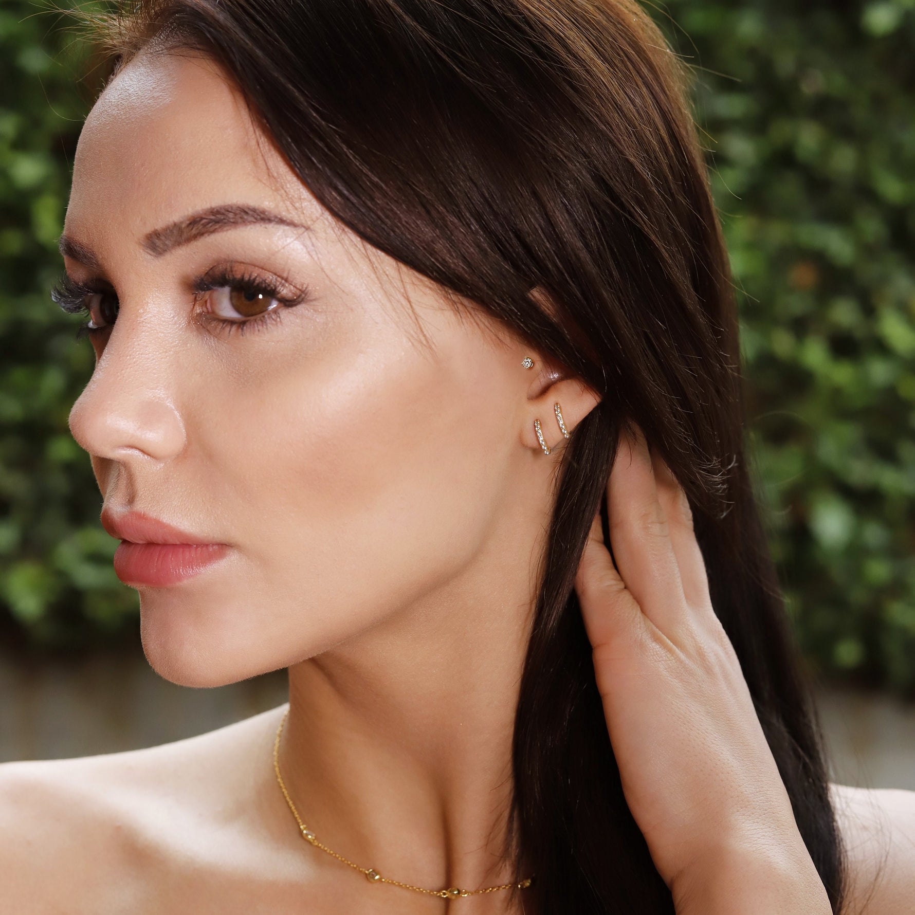 Small gold huggie hoop earrings set by AJJ, minimalist sterling silver hoops with cubic zirconia pave detail, perfect for everyday wear.