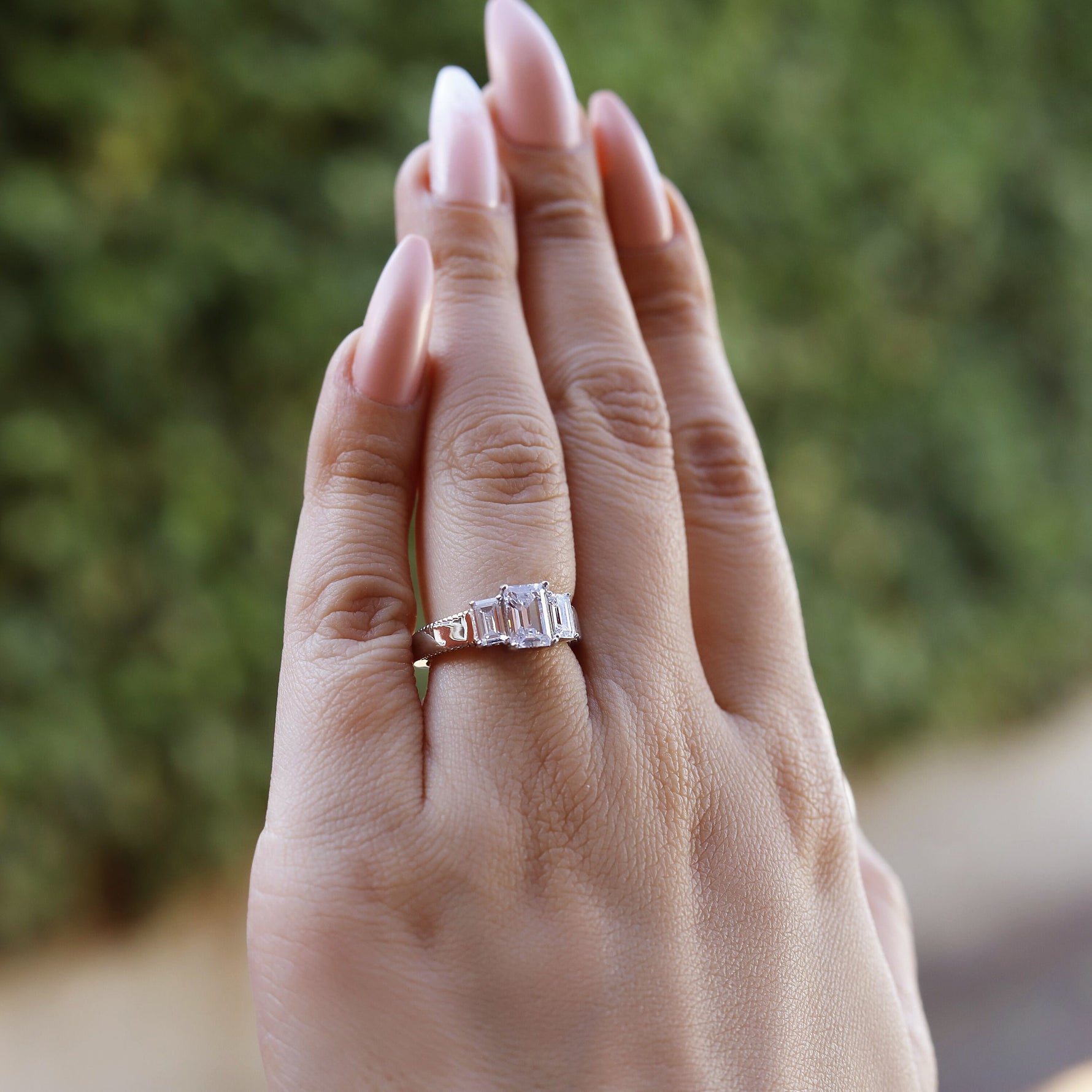 AJJ sterling silver emerald trilogy ring featuring 2.5 ct stones, perfect as an engagement or promise ring for women.