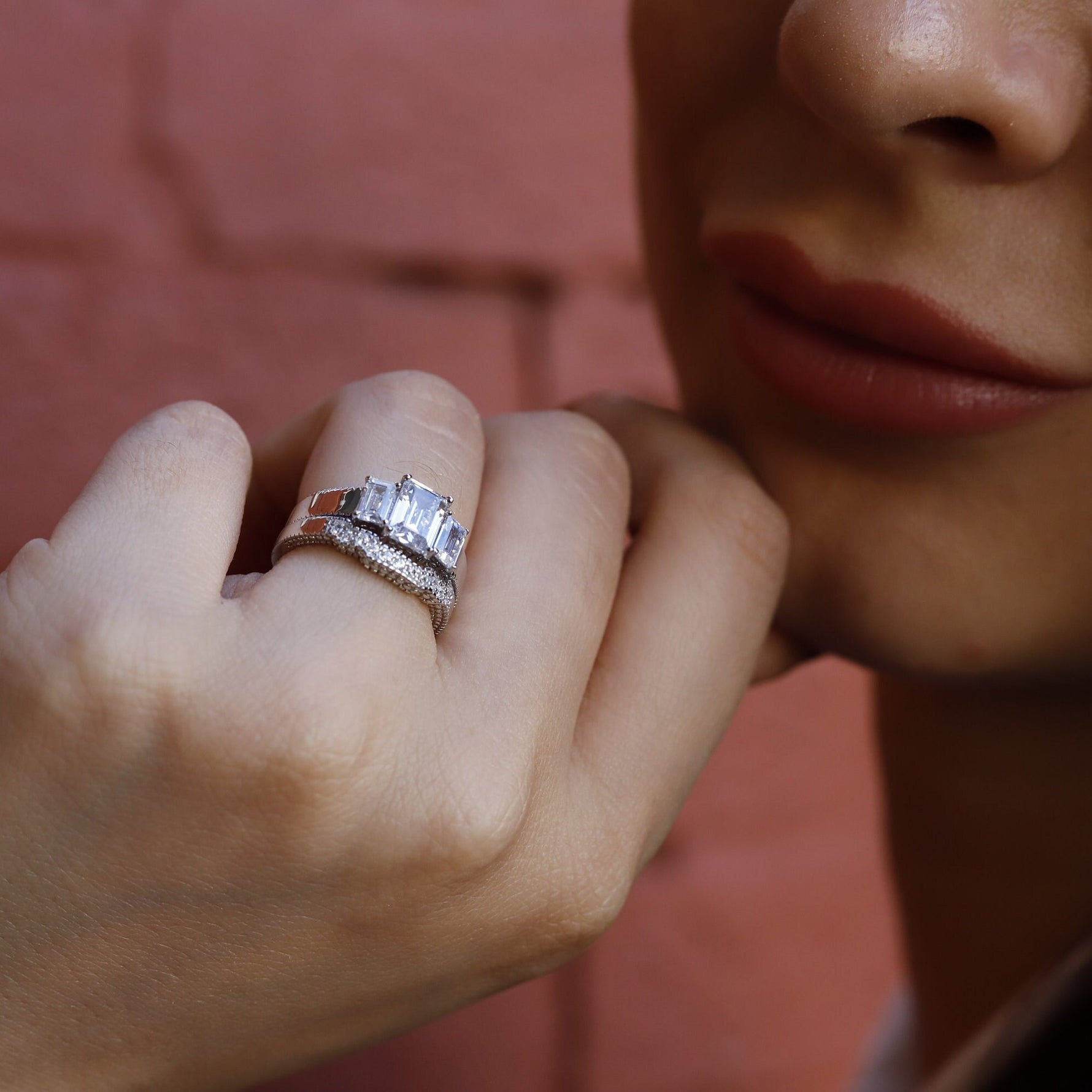 Sterling silver AJJ 2.5 ct emerald trilogy engagement ring with intricate detailing, perfect for promise or bridal settings.