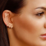 Small gold huggie hoop earrings set with cubic zirconia, minimalist sterling silver hoops with pave detail by AJJ.