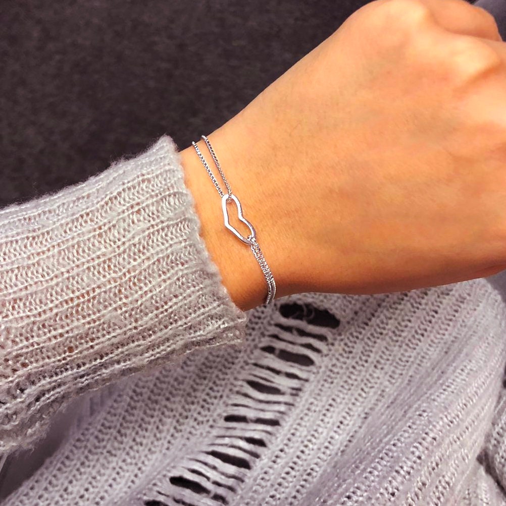 Silver heart charm bracelet by AJJ featuring dainty love heart details, perfect for women and as a thoughtful gift.