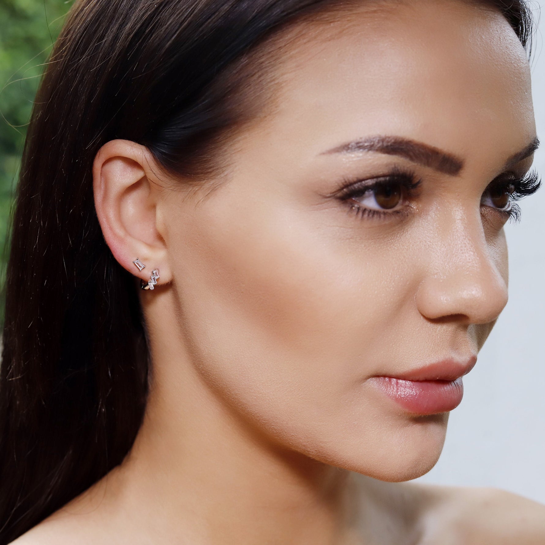 AJJ silver and yellow gold huggie hoops with baguette design, sterling silver 925 cartilage earrings, simple and elegant jewelry.